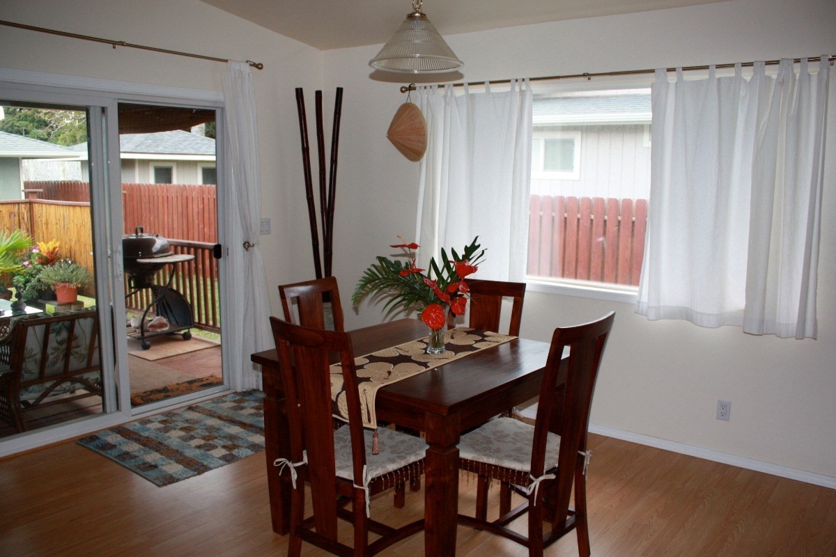 341 Eggerking Road, Unit 1 Kapaa, HI 96746 - Photo 8 of 10 a dining room with furniture and window