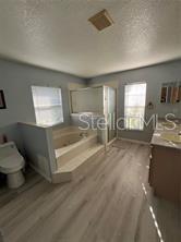 4 Pin Oak Drive Palm Coast, FL 32164 - Photo 13 of 15 a bathroom with a sink a toilet and a tub