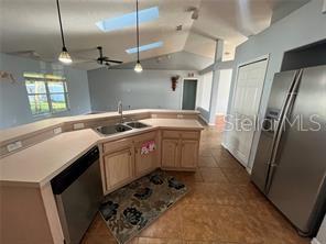 4 Pin Oak Drive Palm Coast, FL 32164 - Photo 4 of 15 a kitchen that has a sink a refrigerator and window