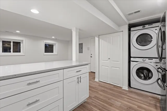 a utility room with sink dryer and washer