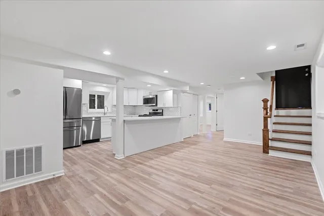 a view of kitchen with wooden floor