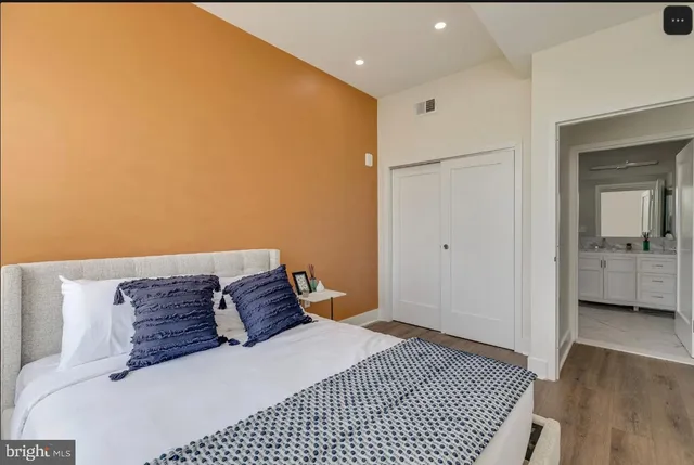 a bedroom with a bed and a view of bathroom