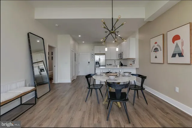 a view of a dining room with furniture and wooden floor