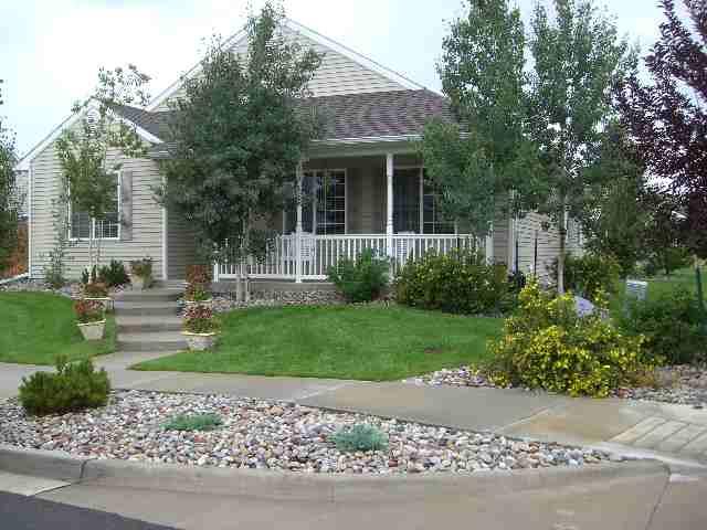 394 Evergreen Drive Rifle, CO 81650 - Photo 1 of 9 a front view of a house with garden