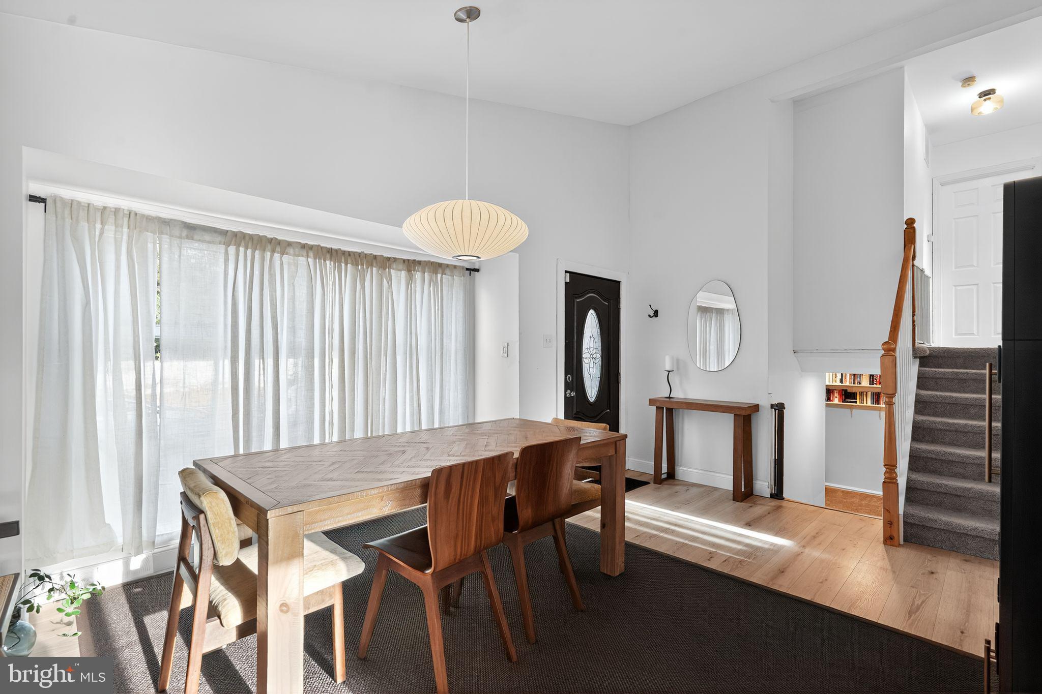333 Jackson Road Mantua, NJ 08051 - Photo 15 of 34 a view of a dining room with furniture window and wooden floor