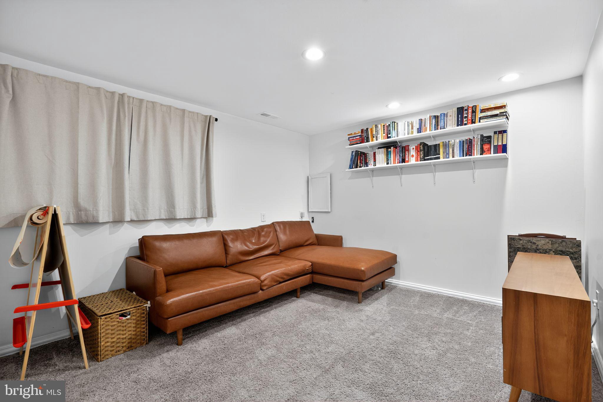 333 Jackson Road Mantua, NJ 08051 - Photo 25 of 34 a living room with furniture a rug and a wooden floor