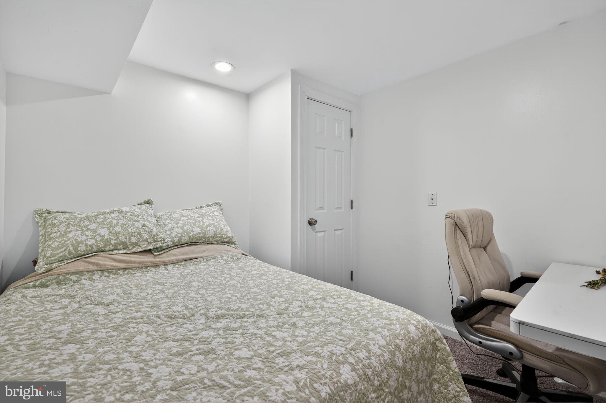 333 Jackson Road Mantua, NJ 08051 - Photo 26 of 34 a bedroom with a large bed and chair