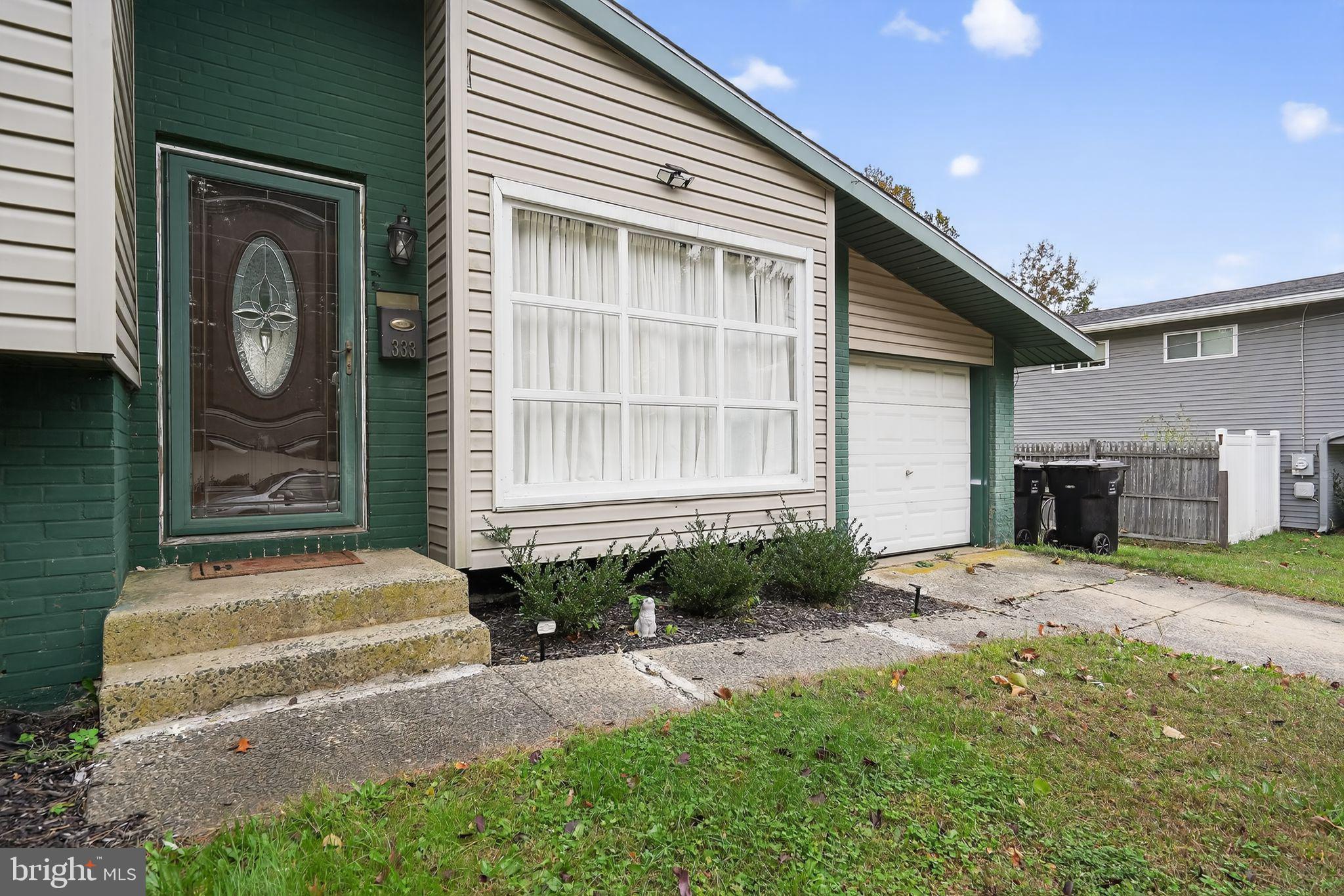333 Jackson Road Mantua, NJ 08051 - Photo 4 of 34 a front view of a house with garden
