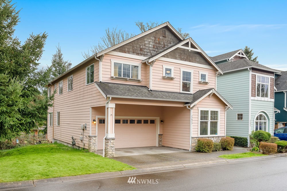 17813 20th Avenue Southeast, Unit 57 Bothell, WA 98012 - Photo 2 of 25 a view of a house with a yard