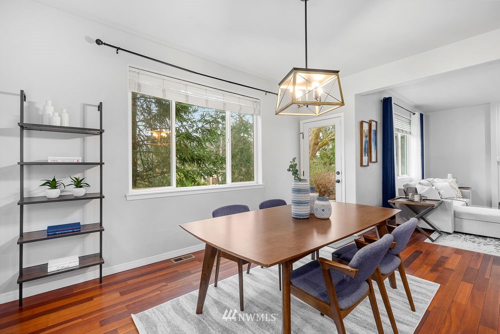 17813 20th Avenue Southeast, Unit 57 Bothell, WA 98012 - Photo 11 of 25 a view of a dining room with furniture window and wooden floor