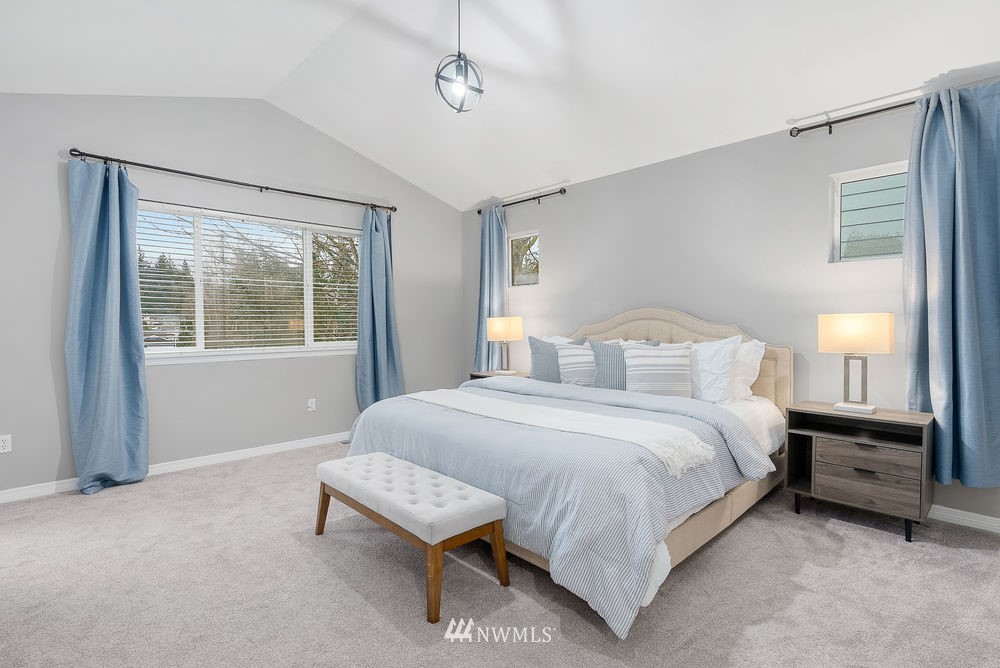 17813 20th Avenue Southeast, Unit 57 Bothell, WA 98012 - Photo 14 of 25 a bedroom with a bed and a window