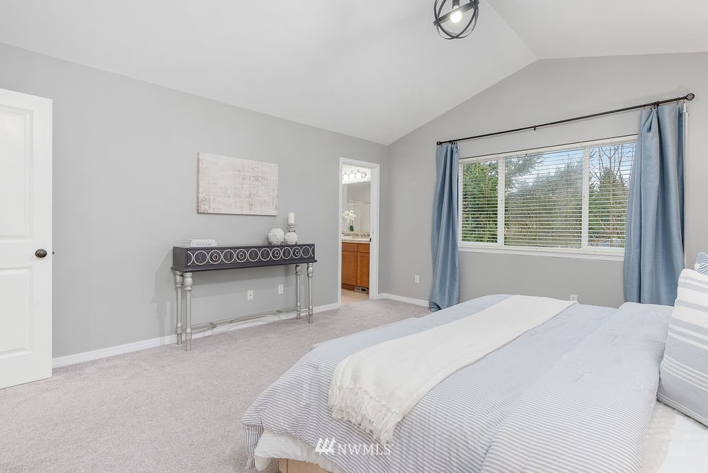 17813 20th Avenue Southeast, Unit 57 Bothell, WA 98012 - Photo 15 of 25 a bedroom with a bed and a window