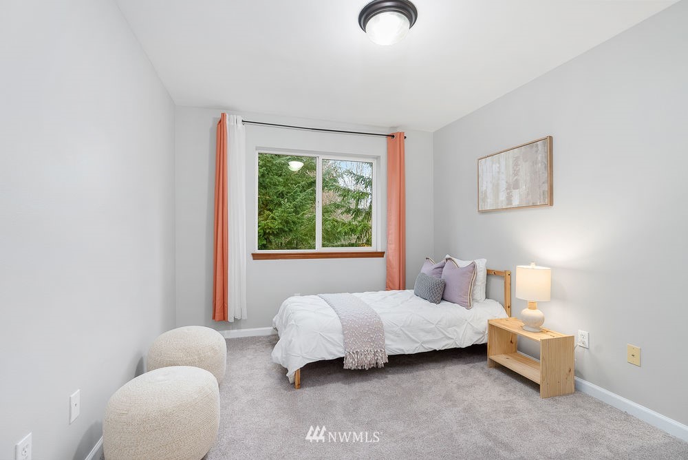 17813 20th Avenue Southeast, Unit 57 Bothell, WA 98012 - Photo 19 of 25 a bedroom with bed and a window