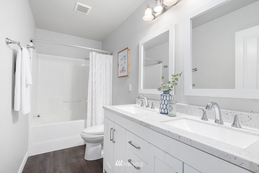 17813 20th Avenue Southeast, Unit 57 Bothell, WA 98012 - Photo 20 of 25 a bathroom with a granite countertop sink toilet and shower