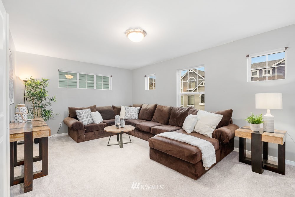 17813 20th Avenue Southeast, Unit 57 Bothell, WA 98012 - Photo 24 of 25 a living room with furniture and a window