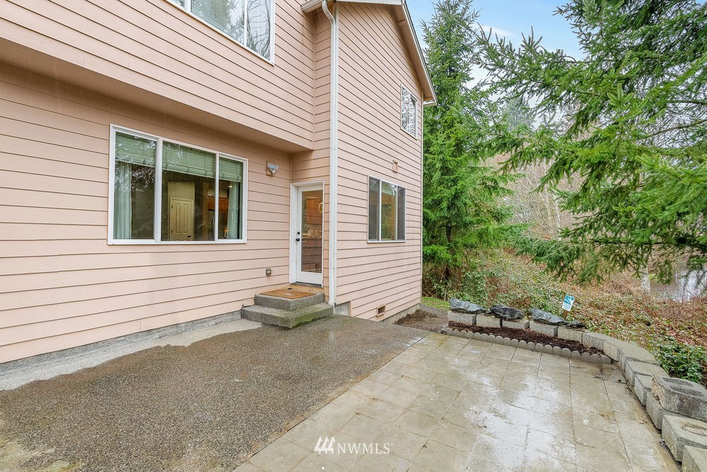 17813 20th Avenue Southeast, Unit 57 Bothell, WA 98012 - Photo 25 of 25 a view of a house with a backyard