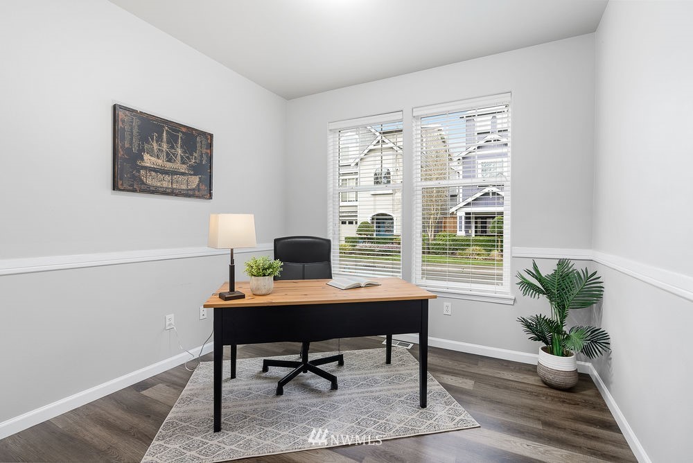 17813 20th Avenue Southeast, Unit 57 Bothell, WA 98012 - Photo 5 of 25 a workspace with furniture and a potted plant