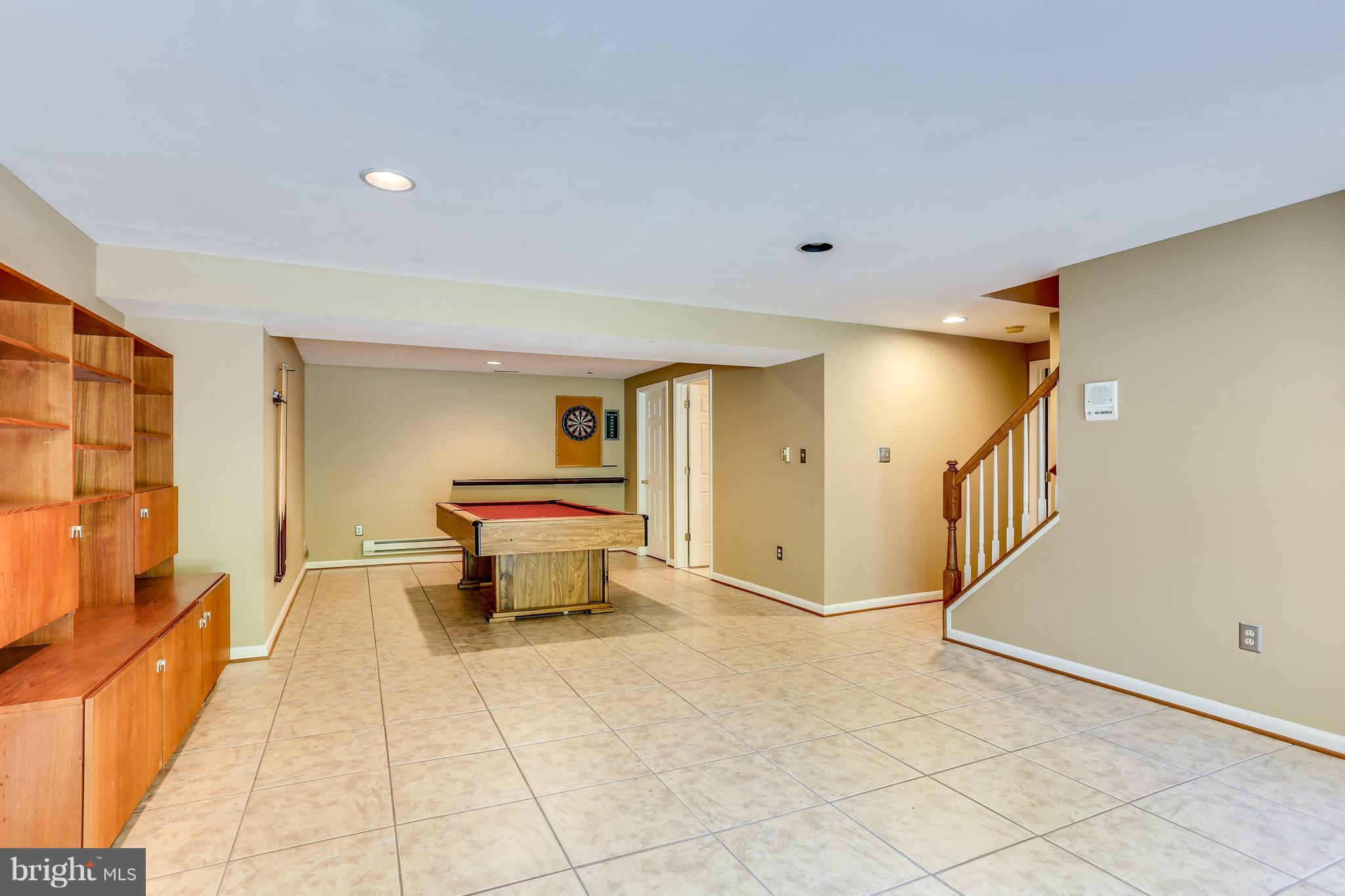8130 Crest Road Laurel, MD 20723 - Photo 23 of 30 Lower Level Rec Room with Large Ceramic Tiles