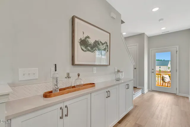 a bathroom with a sink and a large mirror