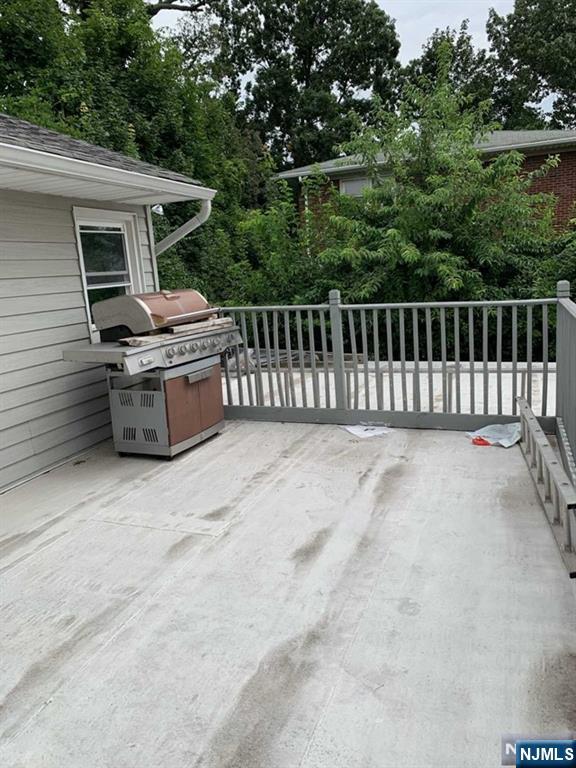 73 East Gouverneur Avenue Rutherford, NJ 07070 - Photo 31 of 33 a view of a patio with a table and chairs