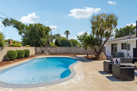 a view of a swimming pool with a patio