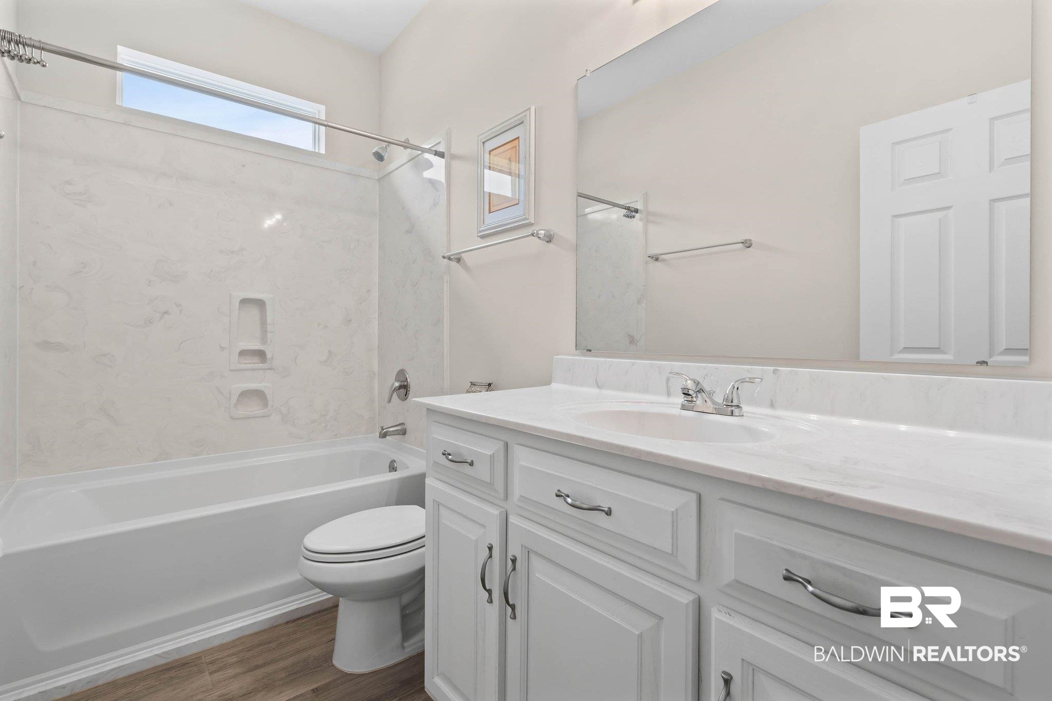 13751 Fish River Acres Circle Foley, AL 36535 - Photo 19 of 26 Bathroom vanity with an integrated sink, white countertop, and white cabinetry