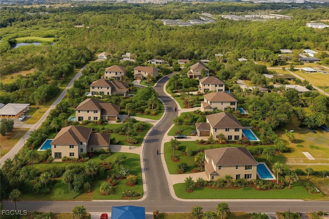 536 Evergreen Road North Fort Myers, FL 33903 - Photo 4 of 19 an aerial view of residential houses with outdoor space and swimming pool