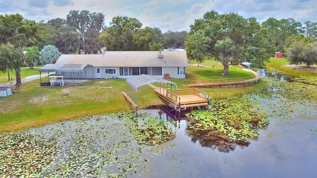 a view of a swimming pool with a yard
