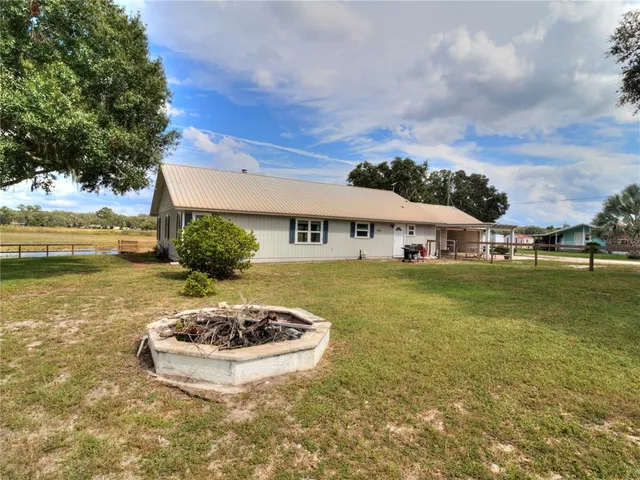 a view of a yard with swimming pool