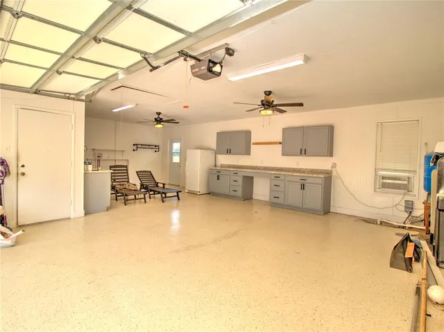 an aerial view of a house with yard