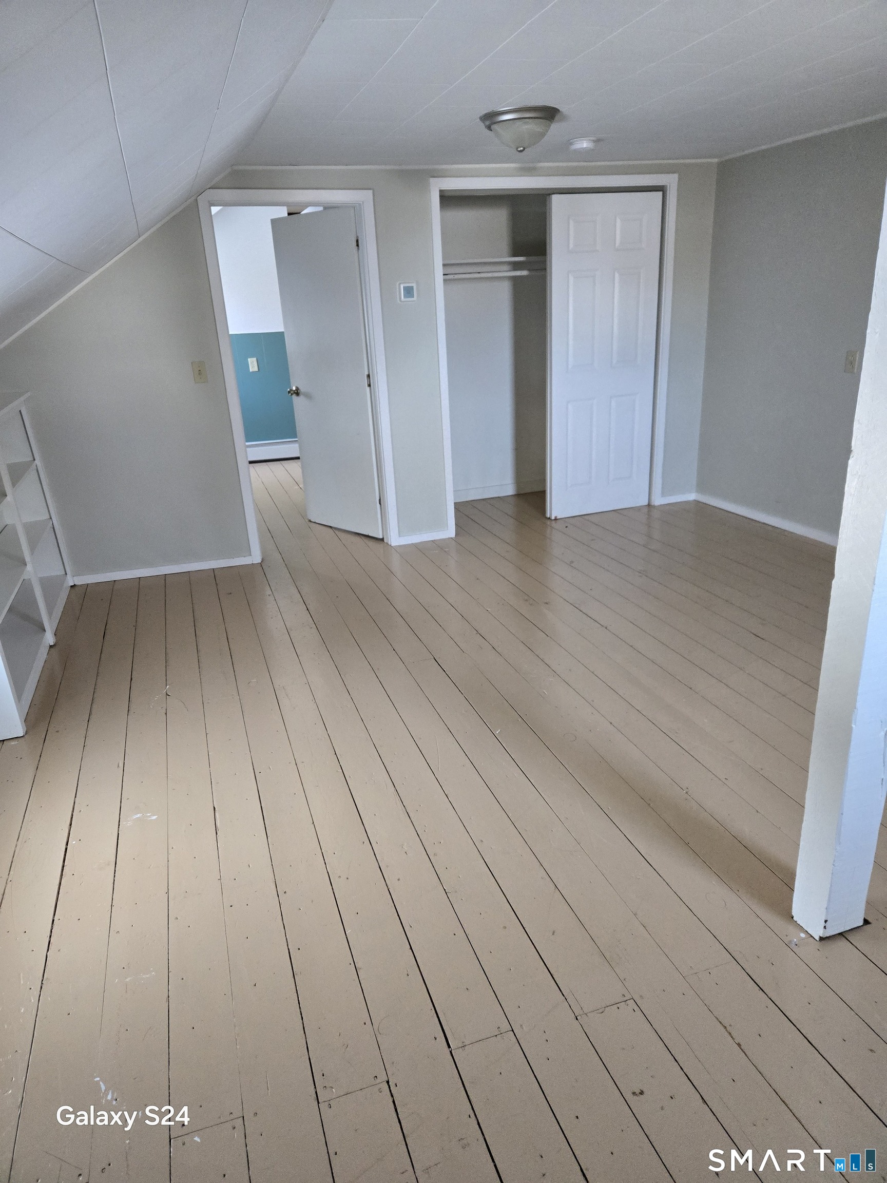 60 Grove Street, Unit B Clinton, CT 06413 - Photo 7 of 11 wooden floor in an empty room