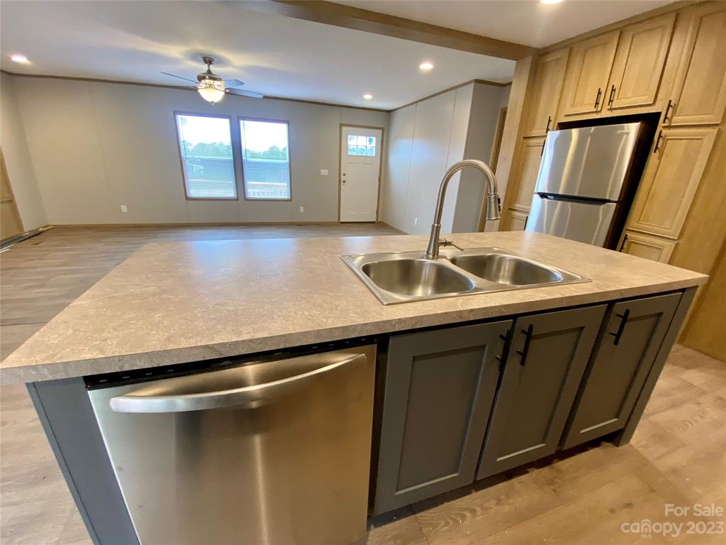 592 Tight Run Loop Rd Union Mills Union Mills, NC 28167 - Photo 11 of 25 a kitchen with a sink a stove and refrigerator