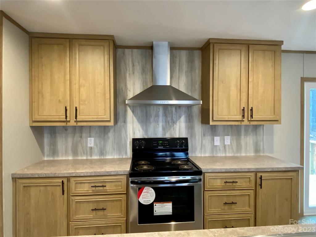 592 Tight Run Loop Rd Union Mills Union Mills, NC 28167 - Photo 12 of 25 a kitchen with stainless steel appliances granite countertop a stove and a granite counter tops
