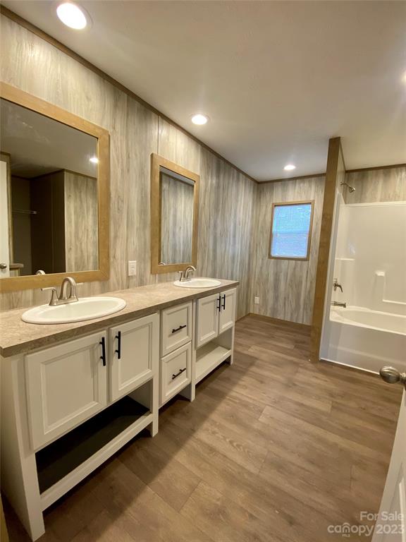 592 Tight Run Loop Rd Union Mills Union Mills, NC 28167 - Photo 19 of 25 a spacious bathroom with double vanity and a mirror