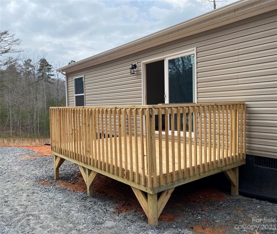 592 Tight Run Loop Rd Union Mills Union Mills, NC 28167 - Photo 25 of 25 a view of a small yard with wooden fence and floor