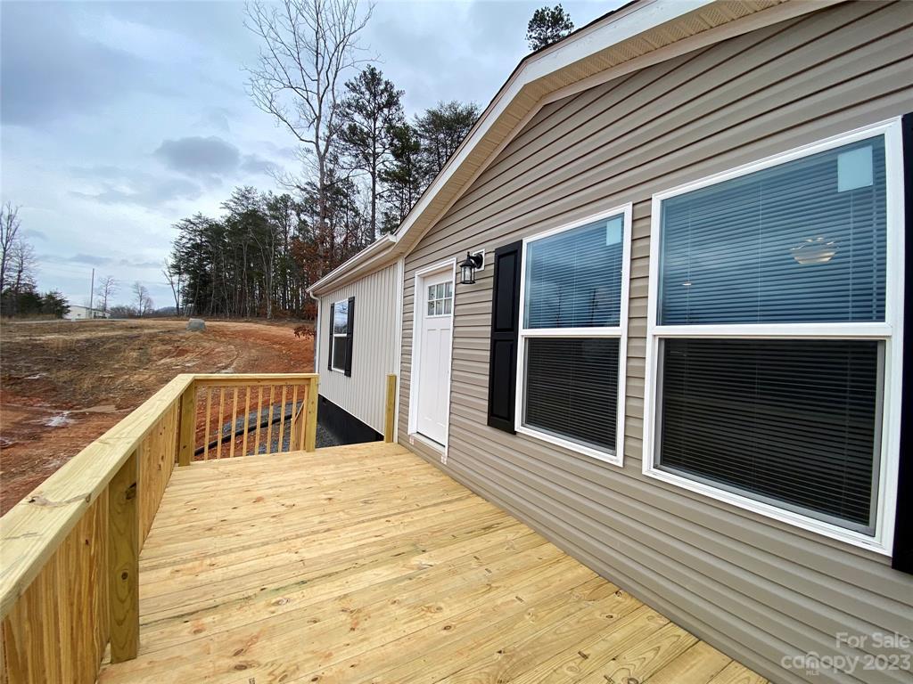 592 Tight Run Loop Rd Union Mills Union Mills, NC 28167 - Photo 4 of 25 a view of a house with a roof deck