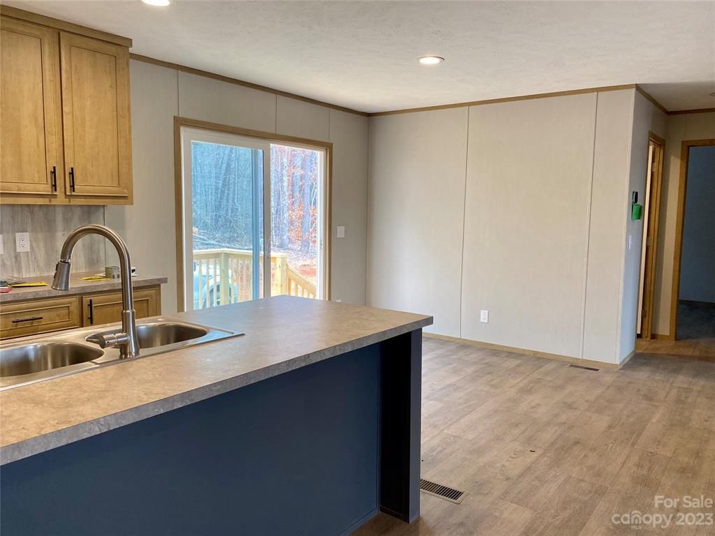 592 Tight Run Loop Rd Union Mills Union Mills, NC 28167 - Photo 6 of 25 a kitchen with granite countertop a sink and a window