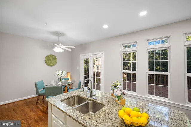 a kitchen that has a sink and cabinets