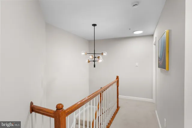 a spacious bedroom with a bed and a large window