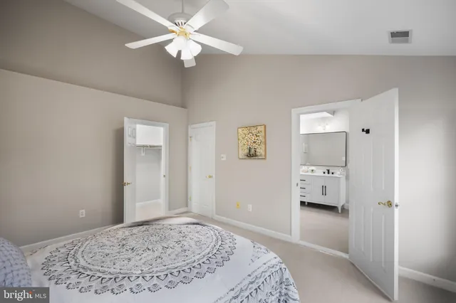 a bathroom with a double vanity sink a mirror and bathtub
