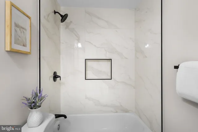 a view of a hallway with washer and dryer
