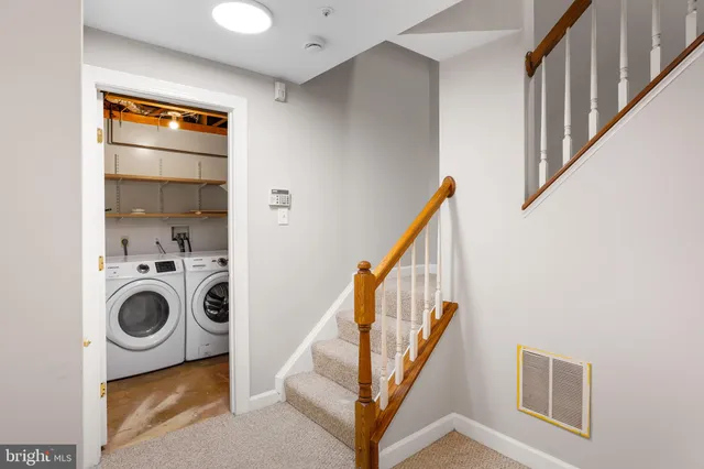 a view of an empty room with a fireplace