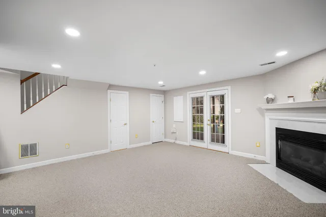 a view of an empty room with a fireplace