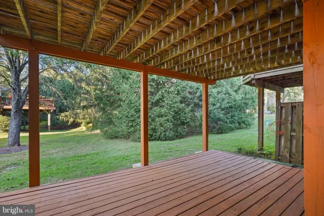 a view of a backyard with wooden floor and wooden floor