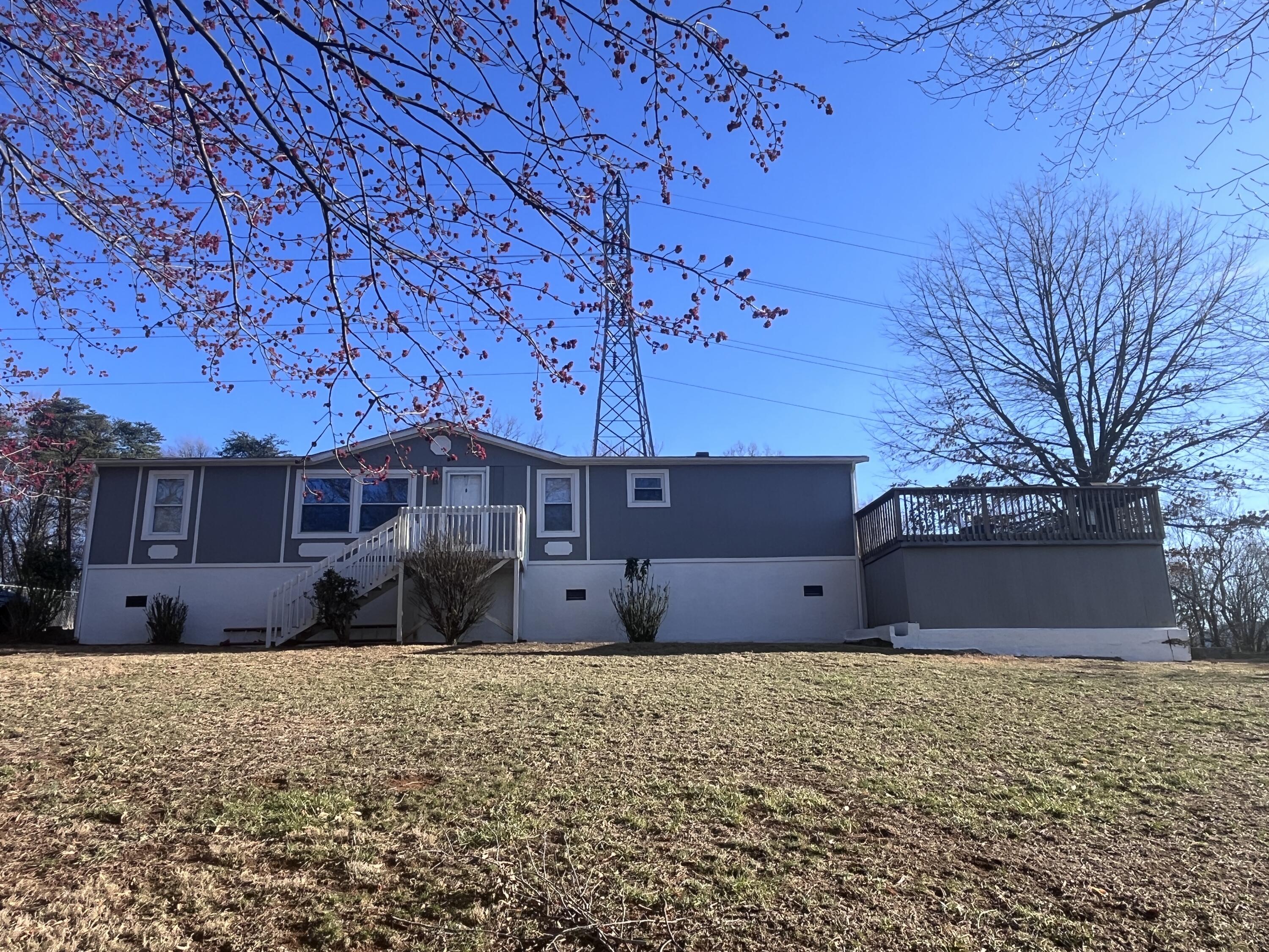 1923 Redwood Road Southeast Roanoke, VA 24014 - Photo 1 of 31 a front view of a house with a yard