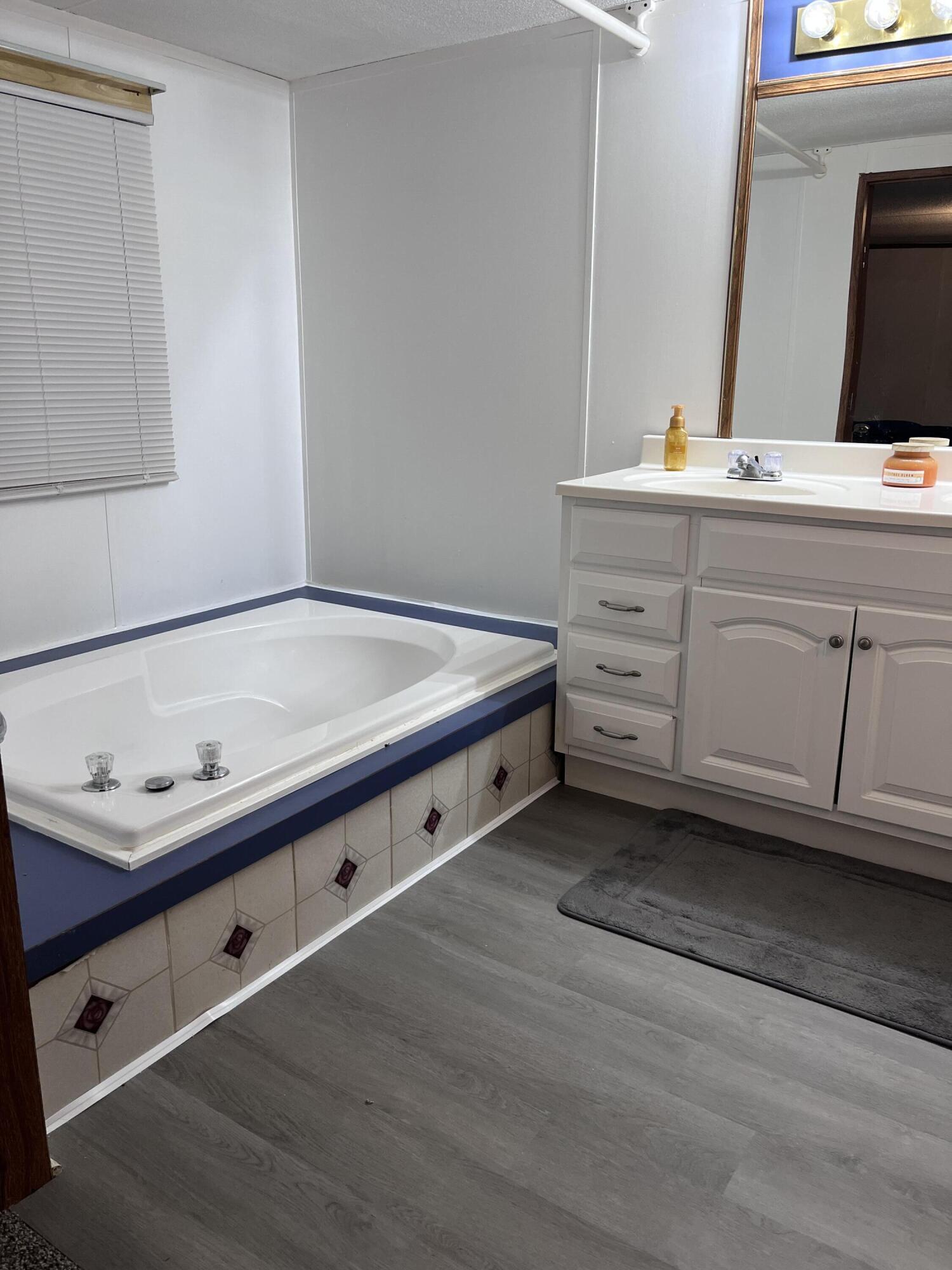 1923 Redwood Road Southeast Roanoke, VA 24014 - Photo 26 of 31 a bathroom with a sink and a mirror
