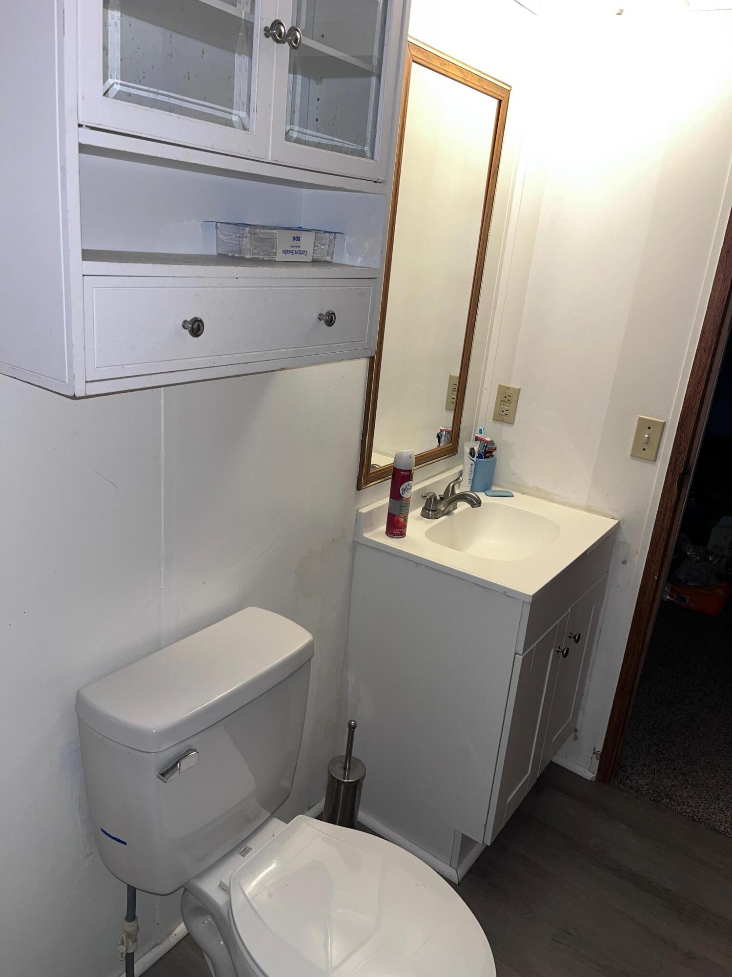 1923 Redwood Road Southeast Roanoke, VA 24014 - Photo 29 of 31 a white toilet sitting next to a bathroom sink