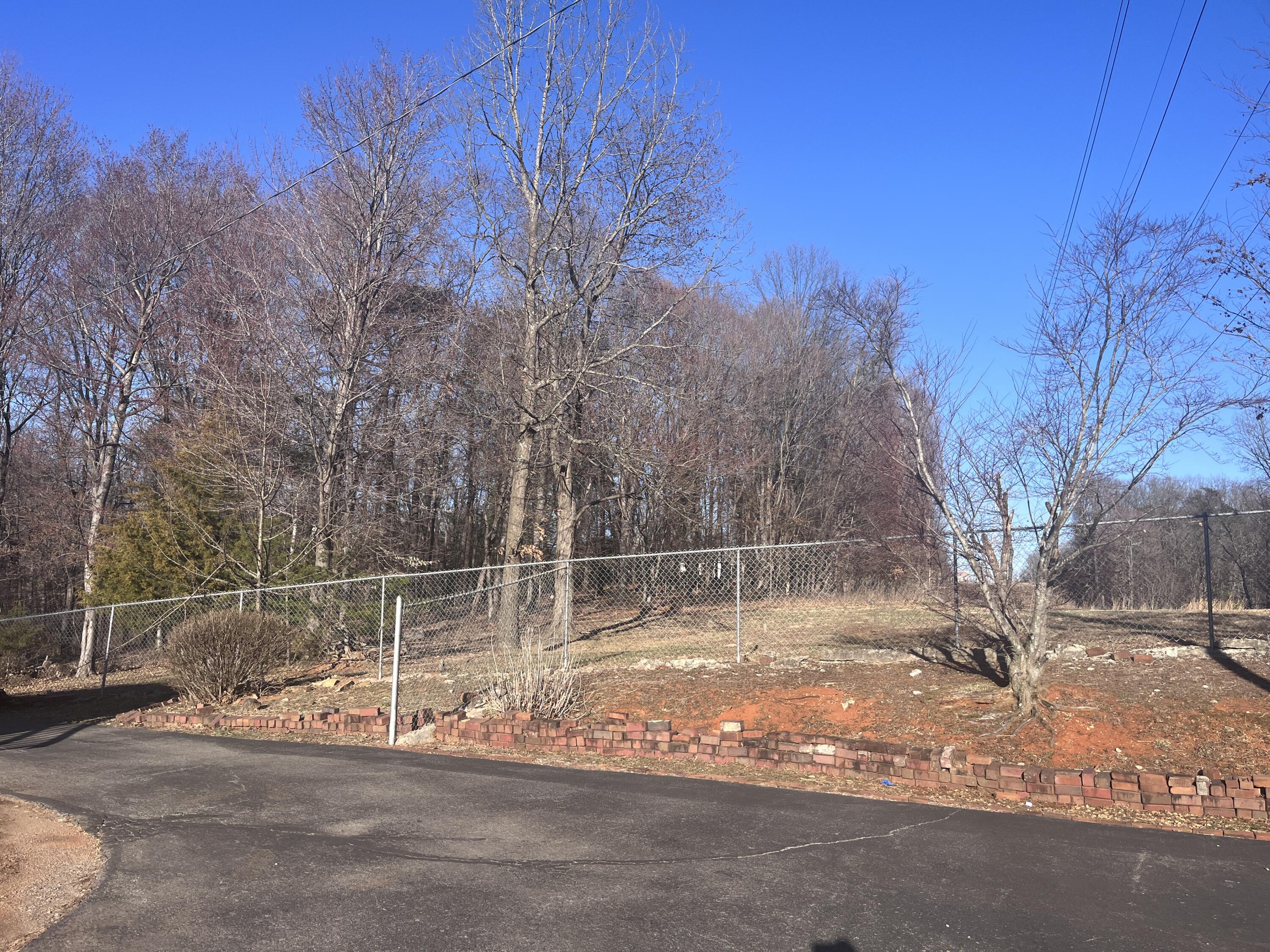 1923 Redwood Road Southeast Roanoke, VA 24014 - Photo 5 of 31 a backyard of a house with table and chairs and wooden fence