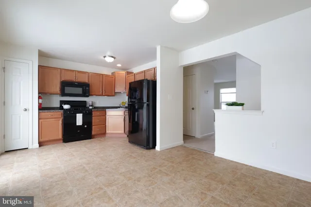 a bathroom with a tub shower and sink