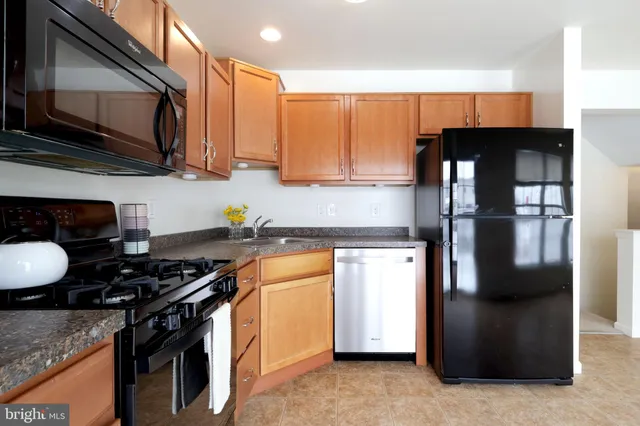 a kitchen with a stove and a microwave